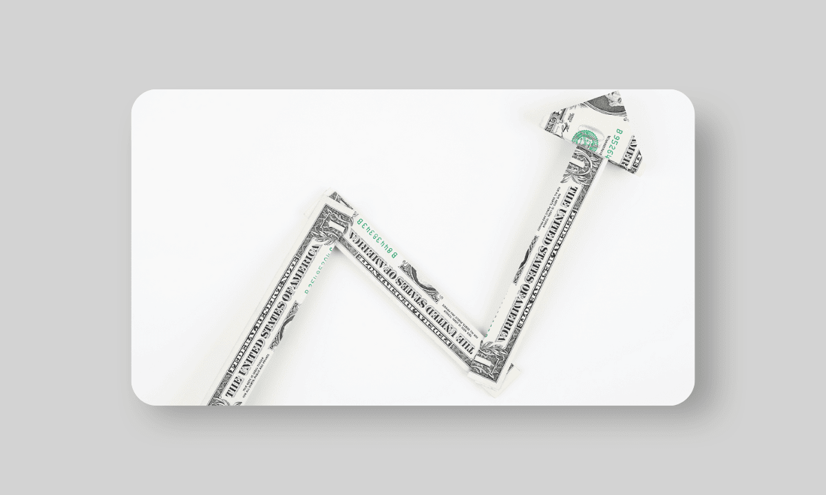 Arrow going up made out of American dollar bills