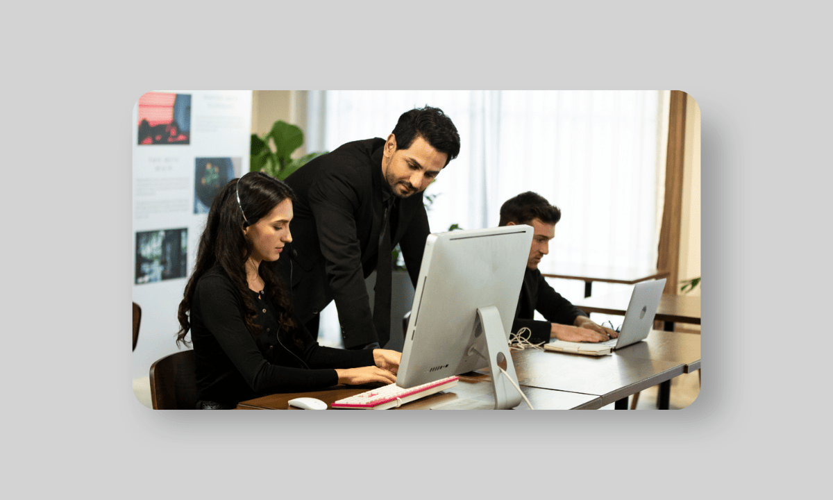 Call center trainer talking to trainee