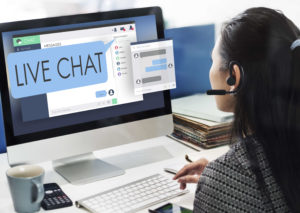Image of a customer service agent on a live chat with a customer