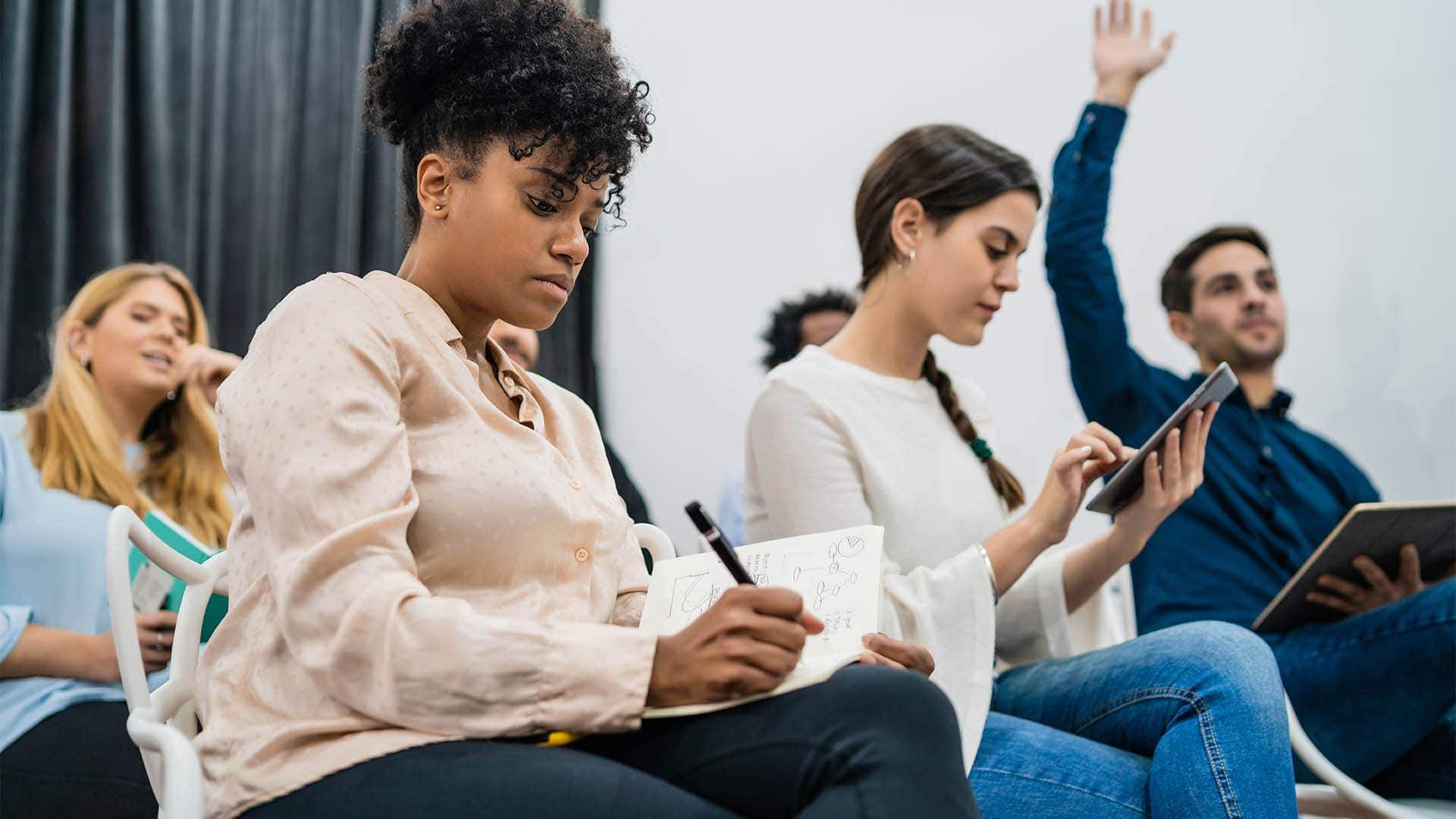 Image of a group of employees actively engaging in COPC In-Person Training